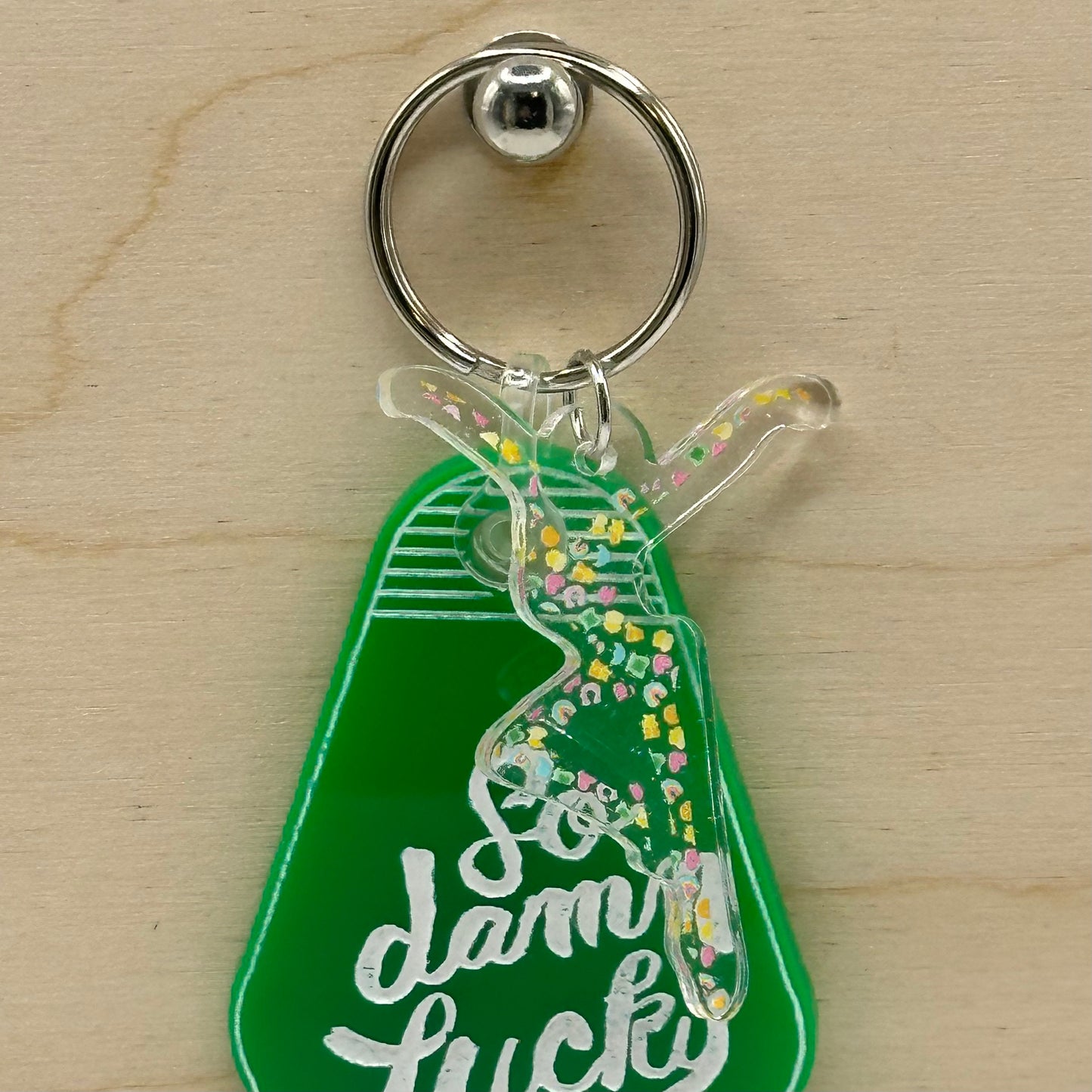 a key chain with a bottle of gummy luck on it