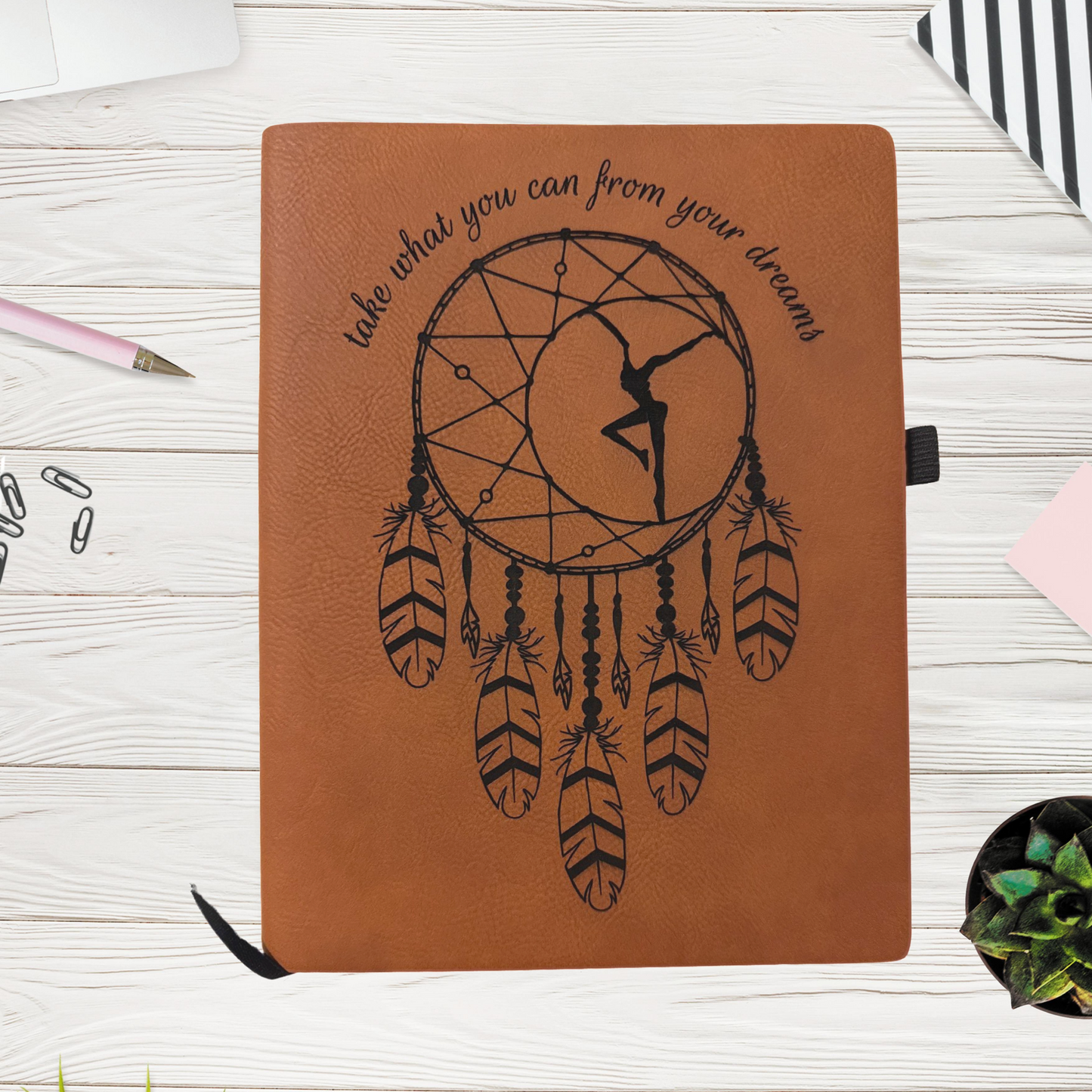a notebook with a drawing of a dancer on it